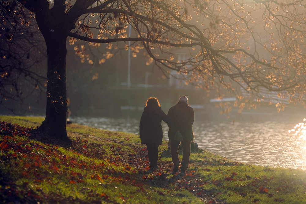 An active older couple walking outdoors, representing vitality and metabolic health.